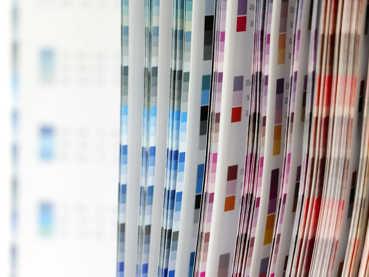 AnimateImage scene: a color swatch book fanned open on a desk
