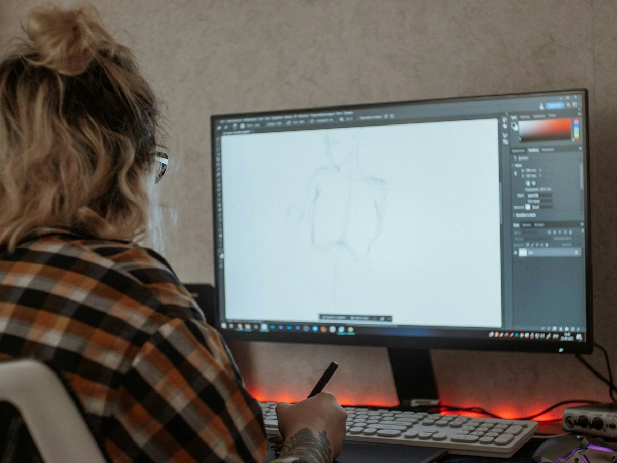 AnimateImage scene of a designer editing a drawing on a large desktop monitor