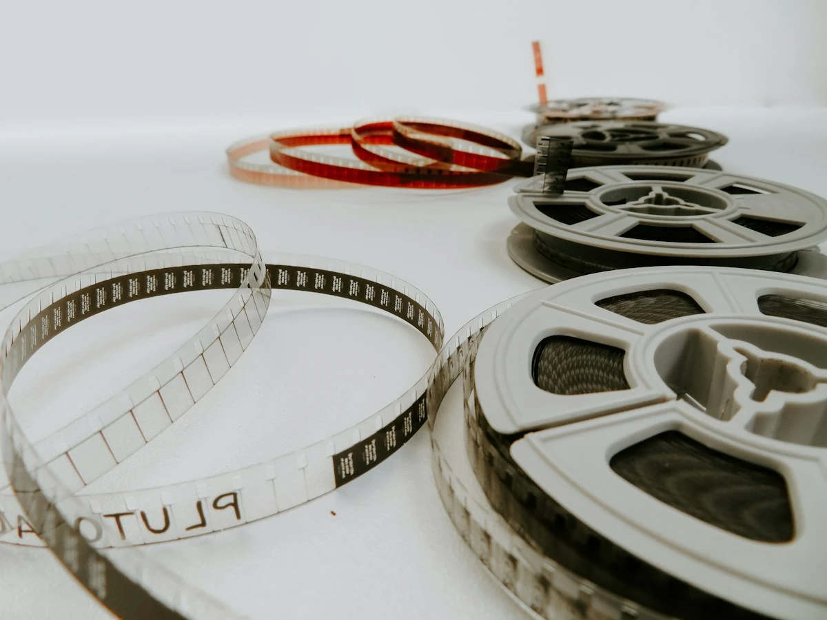 AnimateImage film reels and loose film strips on a white table