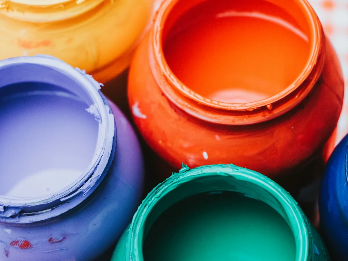 AnimateImage close-up of open paint cans in a few bold colors
