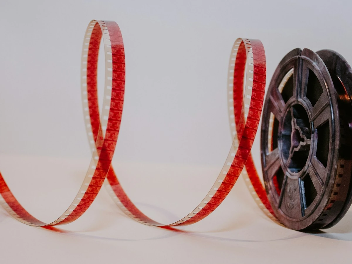 AnimateImage red film strip unrolling from a reel on a light table