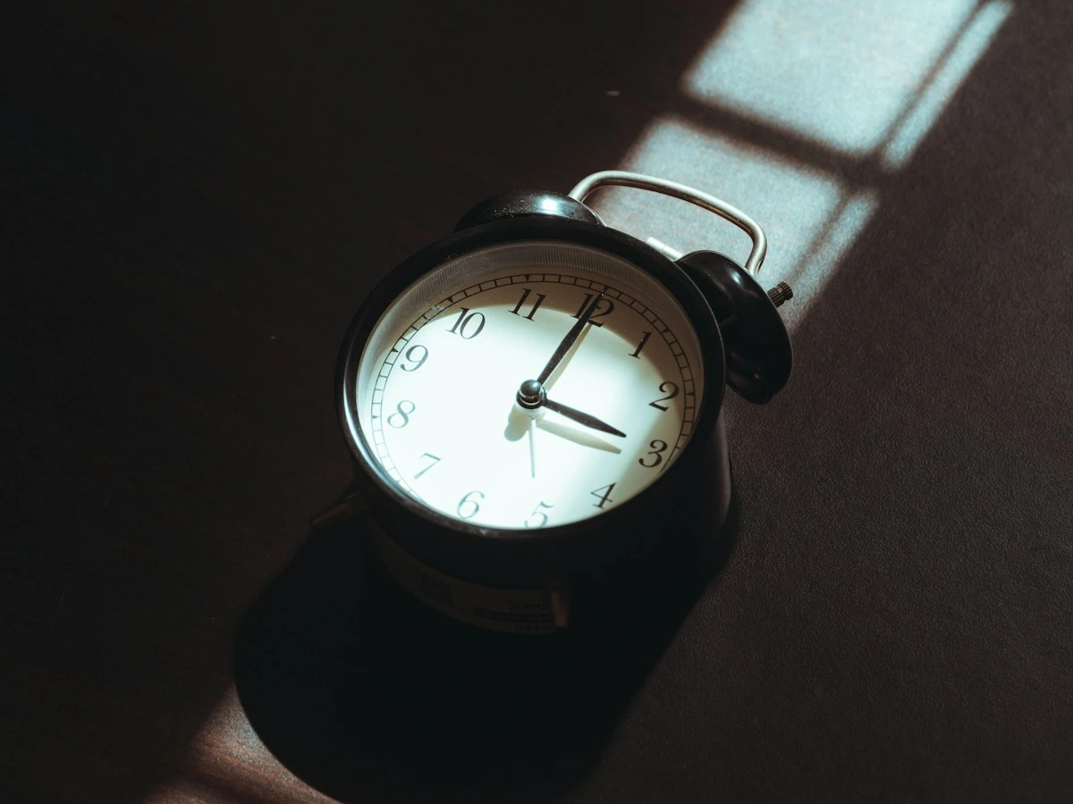 AnimateImage PNG to GIF timing idea: an alarm clock casting a long shadow