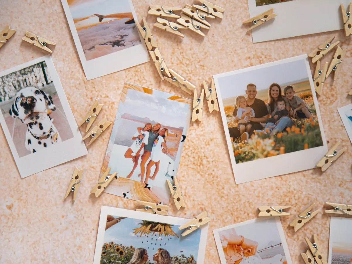 AnimateImage PNG to GIF scene: instant photos and clothespins laid out on a table